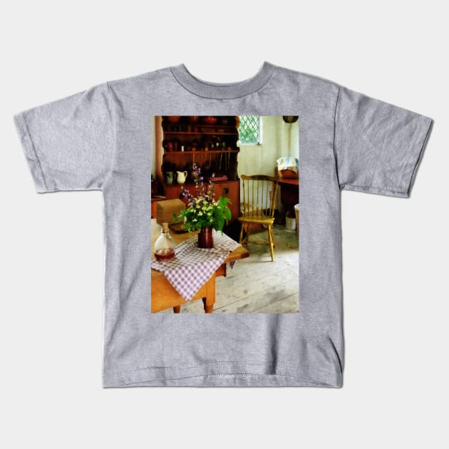 Kitchens - Wildflowers on Kitchen Table Kids T-Shirt by SusanSavad